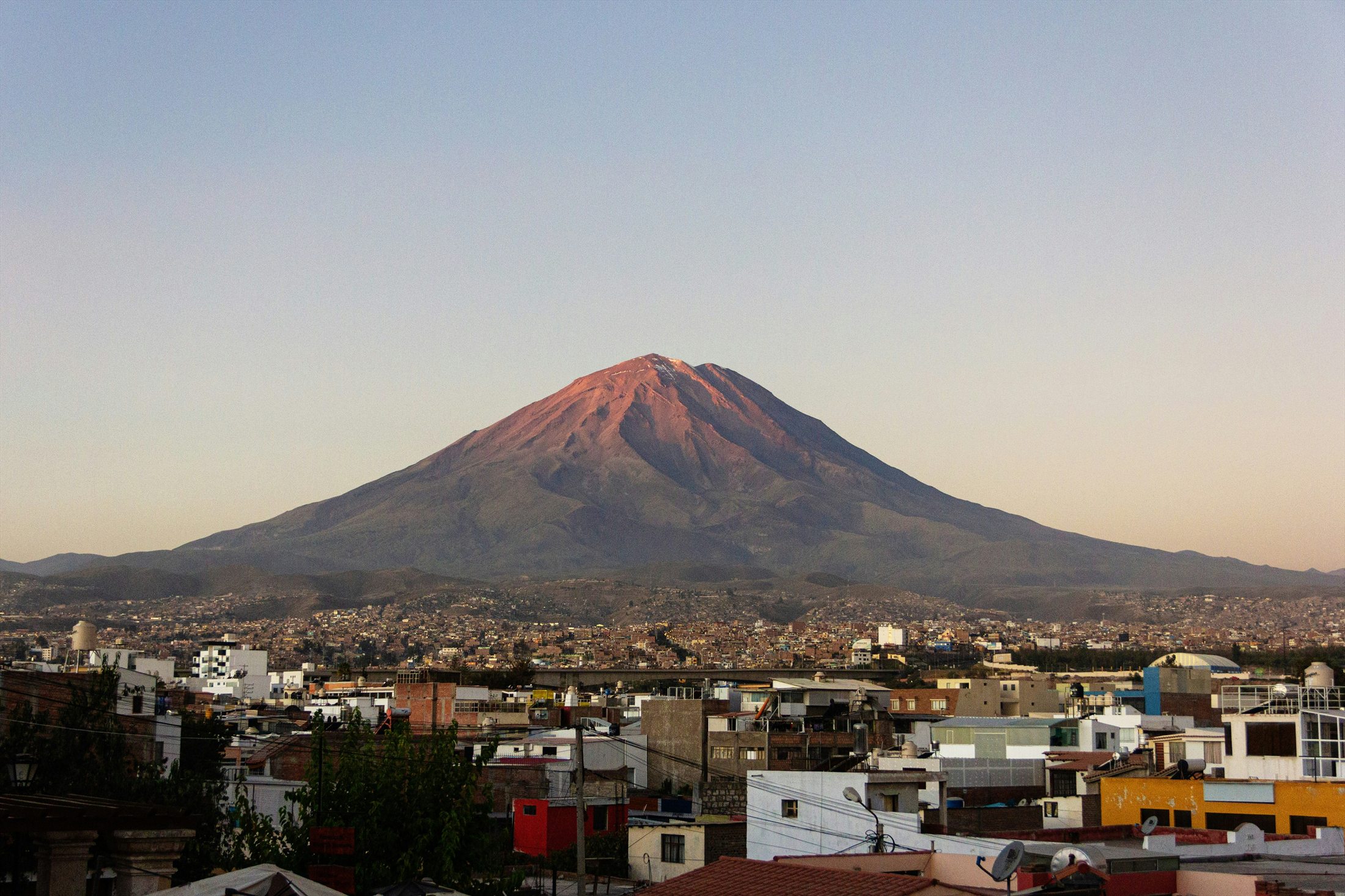 Arequipa below a volcano at sunset