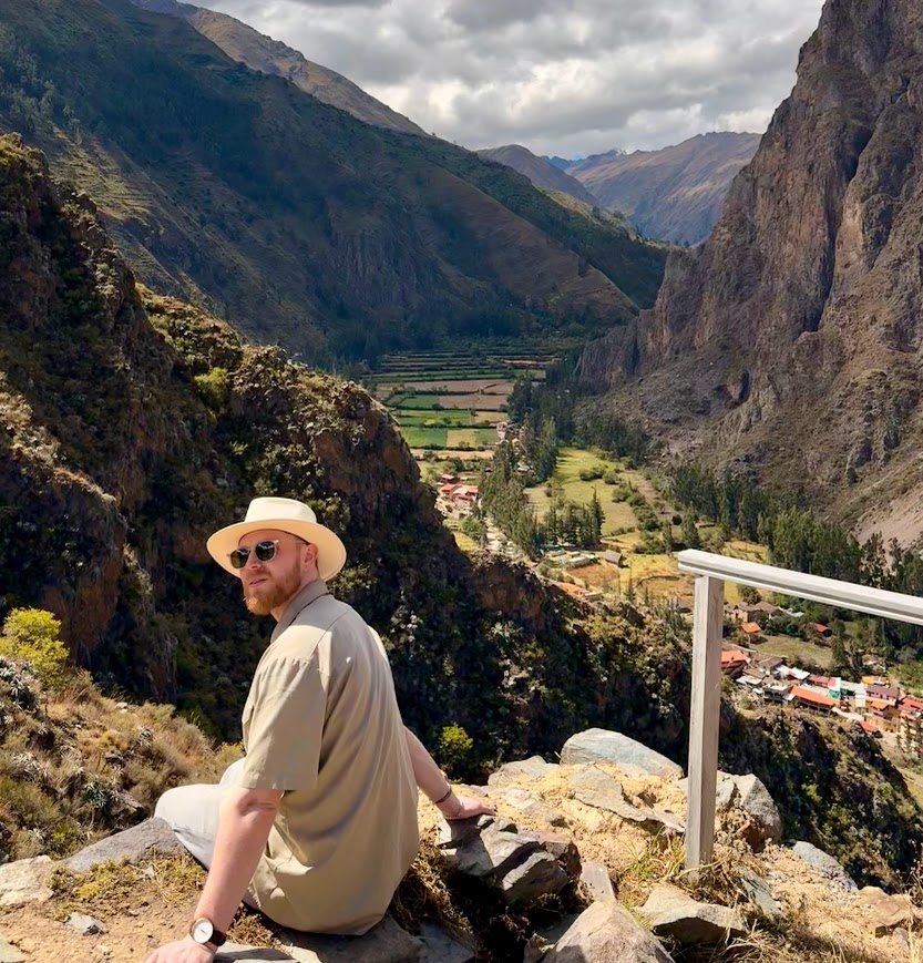 Bad Digital Nomad looking across a mountain valley