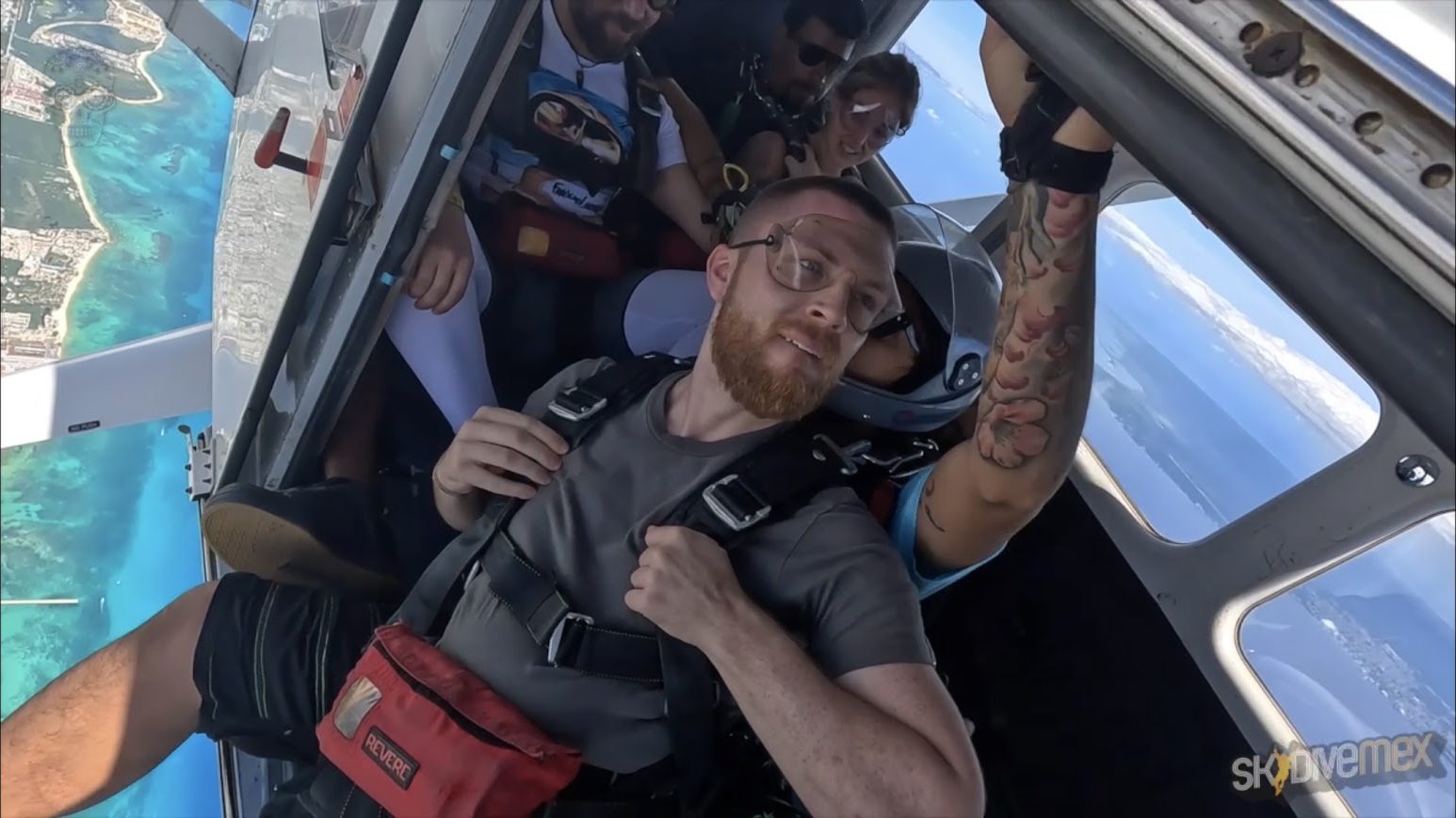 The Bad Digital Nomad preparing to skydive above the coast